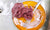 A foamyFischnetz with benefits on a brown plate. It is the best alternative for dish sponges.